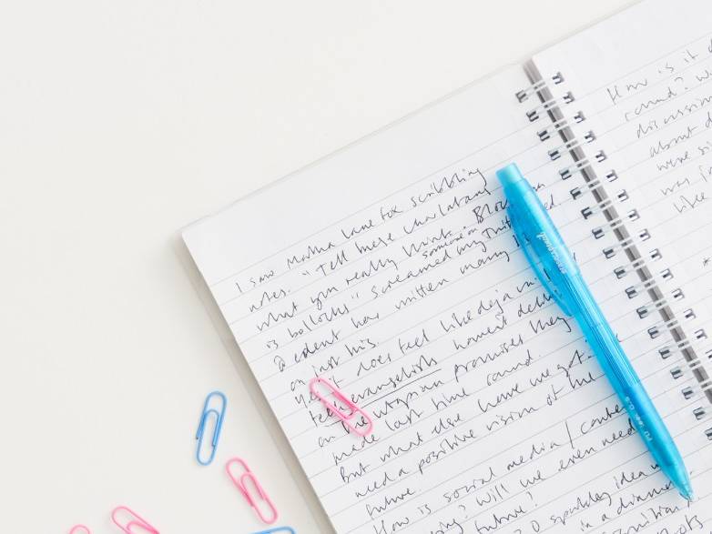 Open notebook with scribbled notes for my social media newsletter